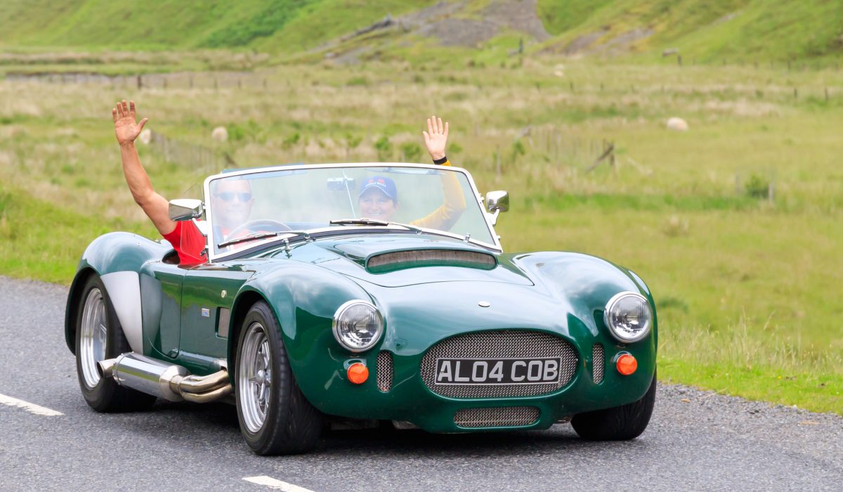 Moffat, Scotland - June 29, 2019:  AC Cobra kit car  in a classic car rally en route towards the town of Moffat, Dumfries and Galloway